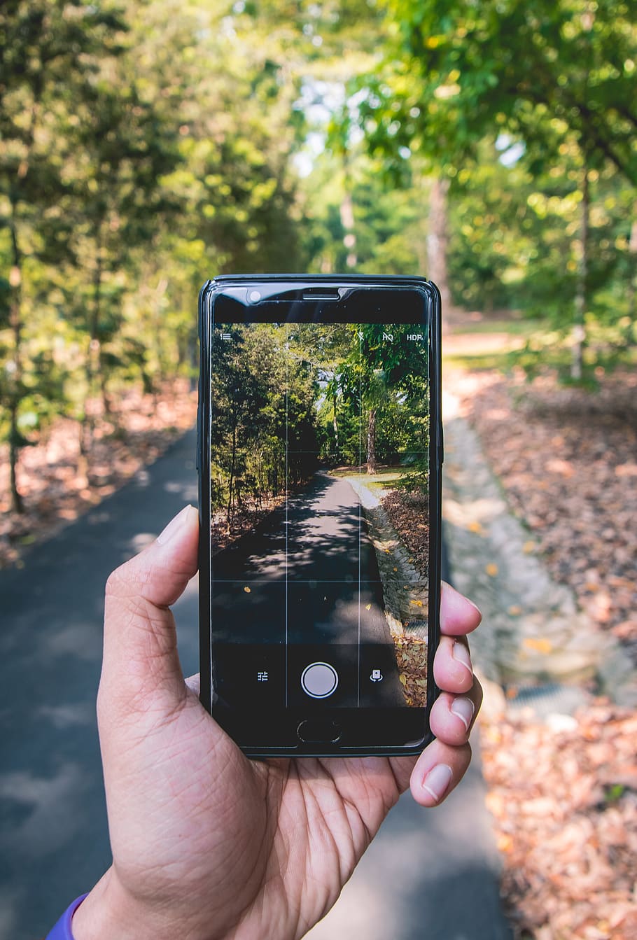 black smartphone on hand, human hand, holding, photography themes HD wallpaper