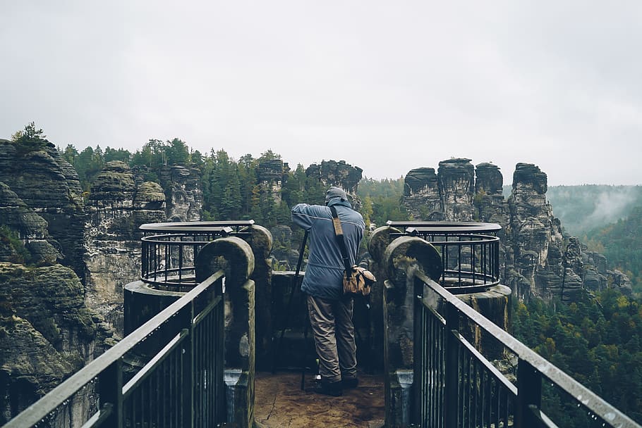 Man Standing on House, cliff, clouds, cloudy, daylight, environment HD wallpaper