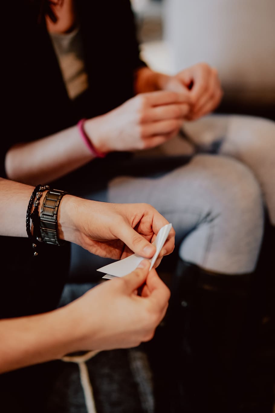 Women folding sheet of paper while making origami, creative, workshop HD wallpaper