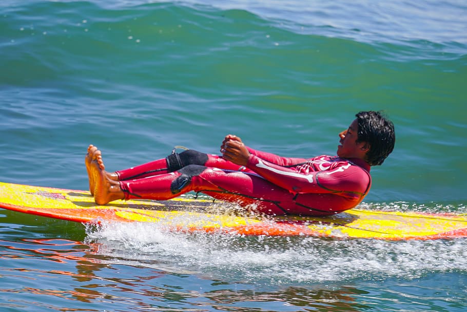 Man Lying Down on a Yellow Surfboard, beach, fun, leisure, ocean HD wallpaper