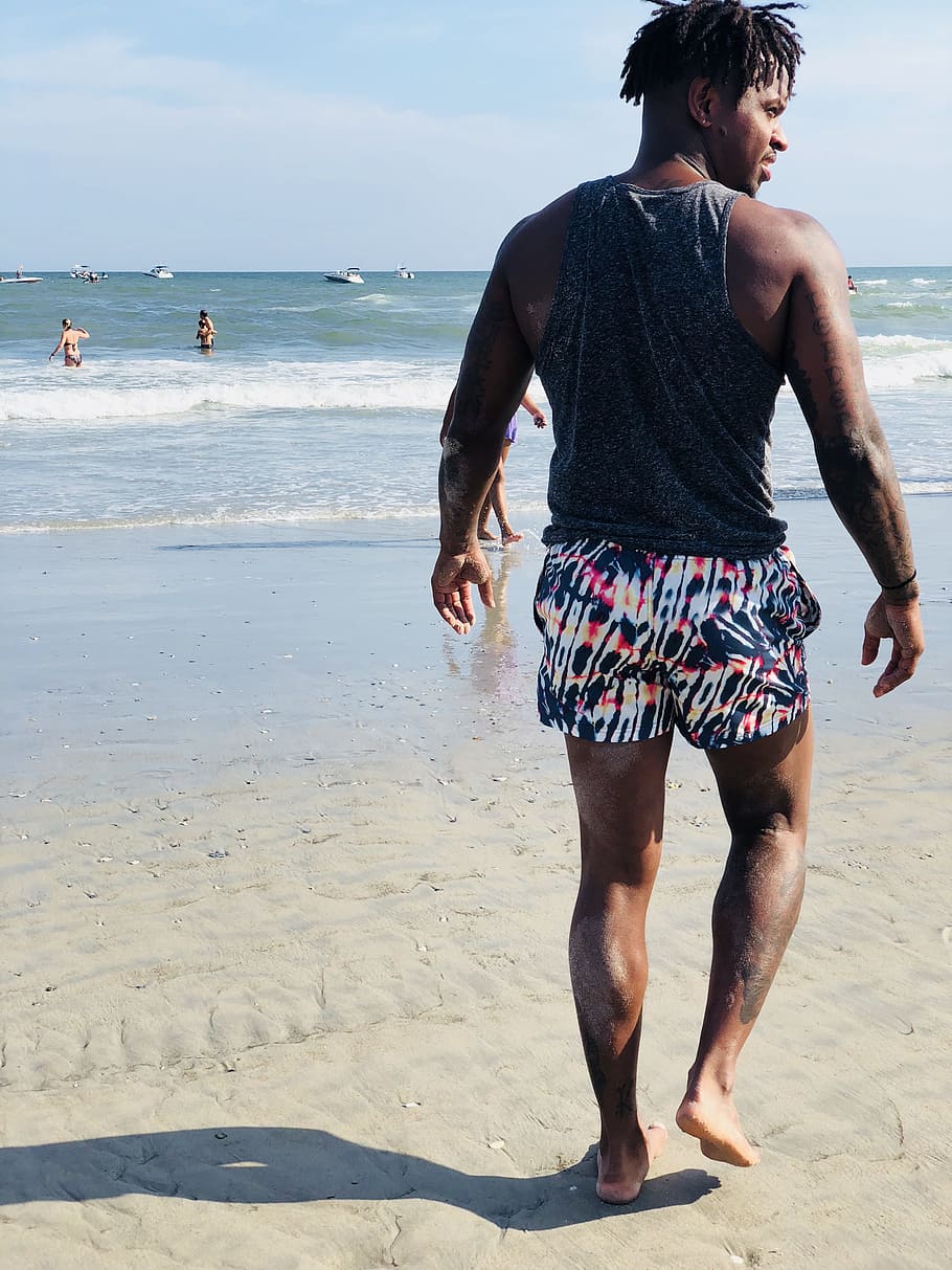Man Wearing Grey Tank Top Walking On Seashore, beach, fun, leisure HD wallpaper