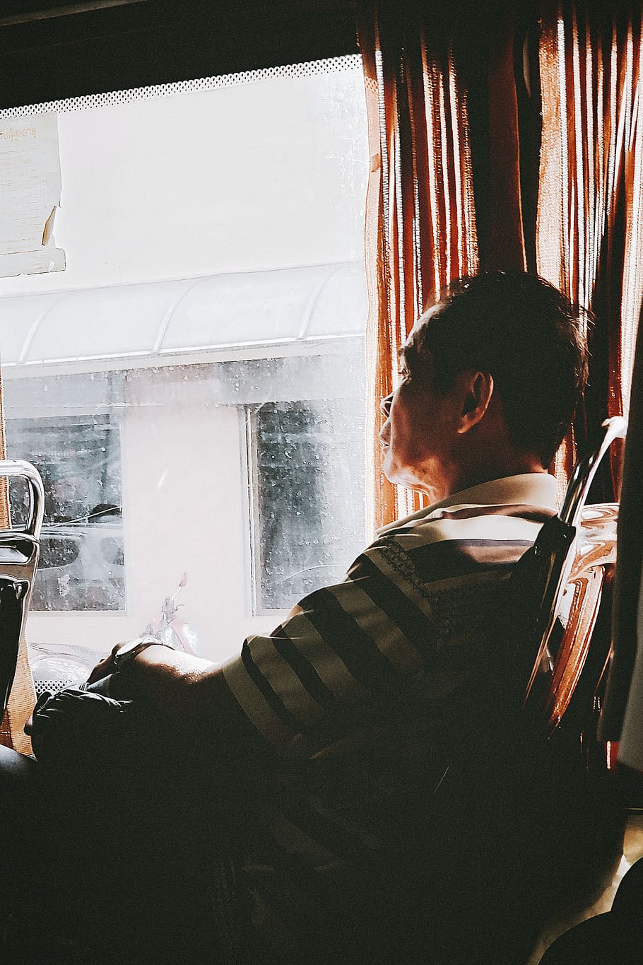 man sitting inside bus, human, person, outdoors, apparel, clothing HD wallpaper
