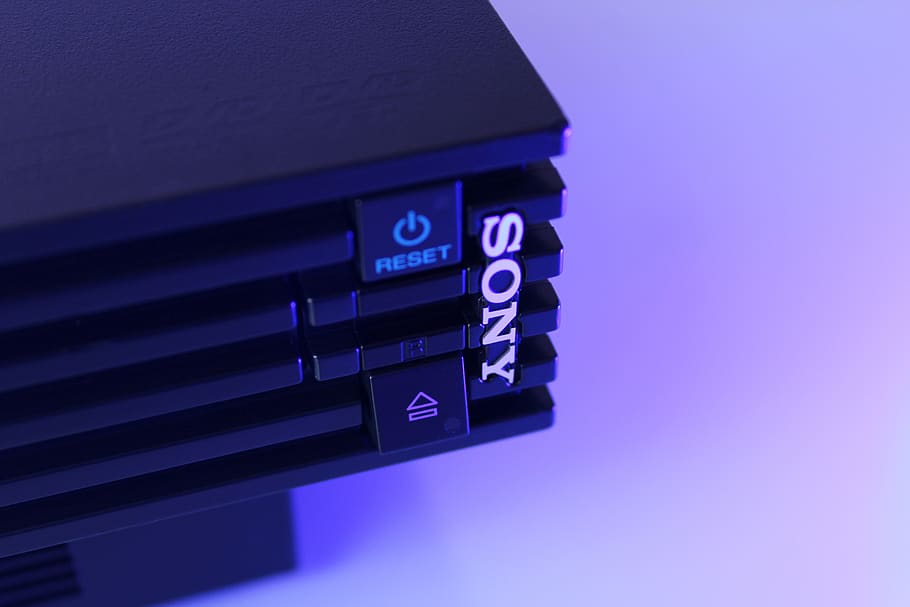 black Sony game console, technology, blue, studio shot, indoors