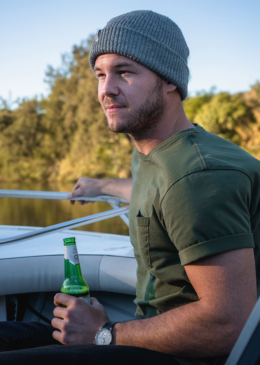 Man Holding Bottle , beanie, fine-looking, good-looking, person HD wallpaper