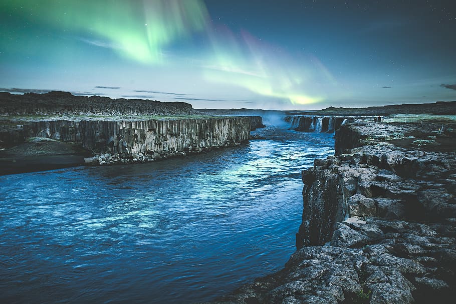 Body of Water Between Rock Formation, aurora borealis, clouds HD wallpaper