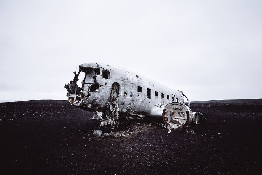 wrecked gray military airplane, icelandic, beach, sand, black