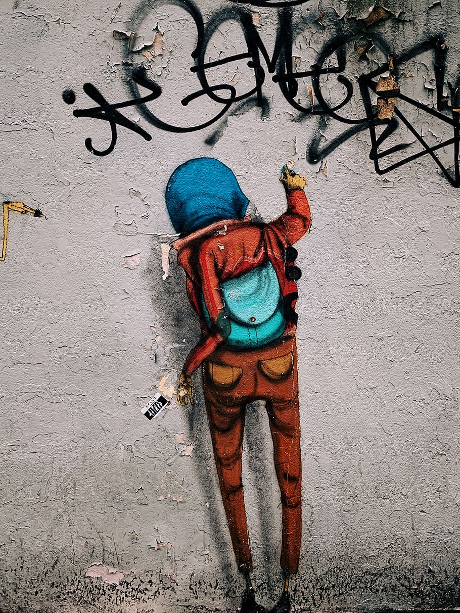 orange and blue hooded person wall art, graffiti, text, asphalt