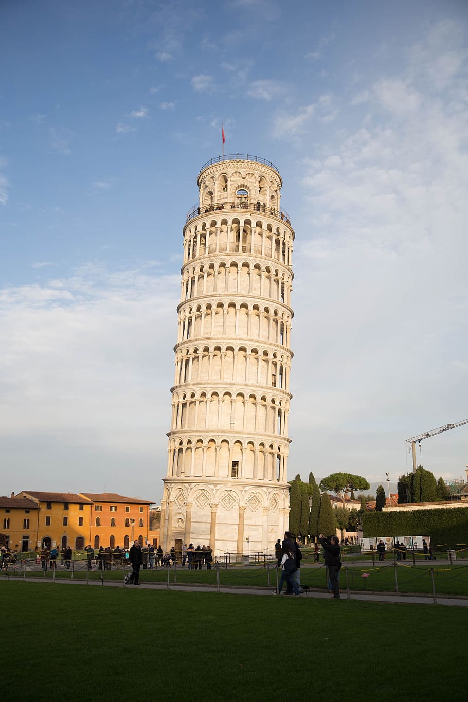 Leaning tower of Pisa, Italy surrounded by tourists, arch, architectural