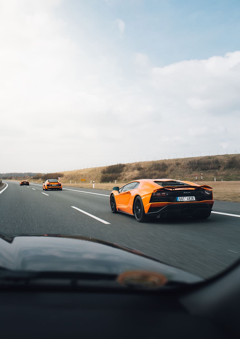 orange Lamborghini on road, car, transportation, motor vehicle HD wallpaper
