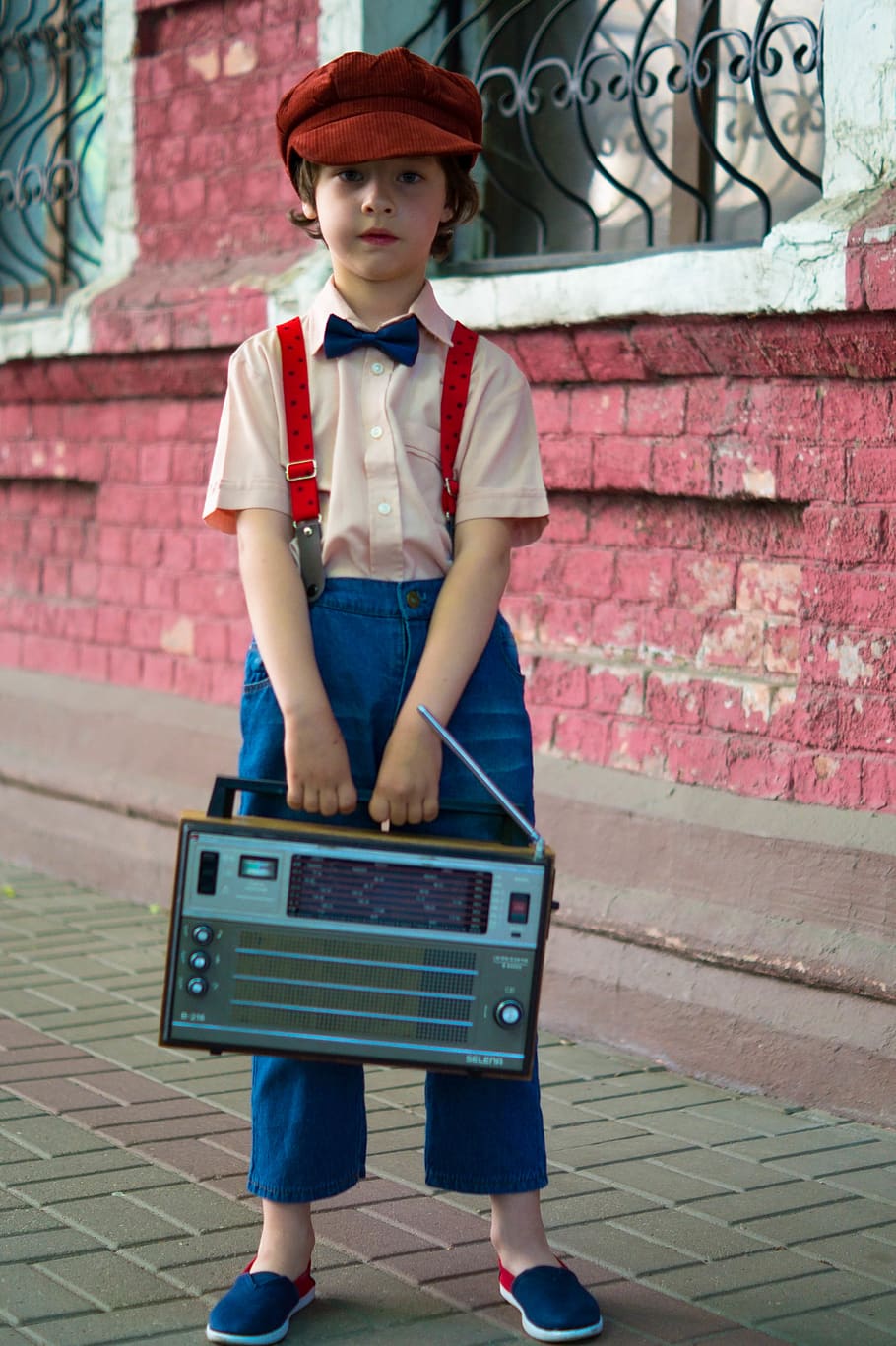 Photo of Boy Holding Radio and Standing Beside of Red House, child HD wallpaper