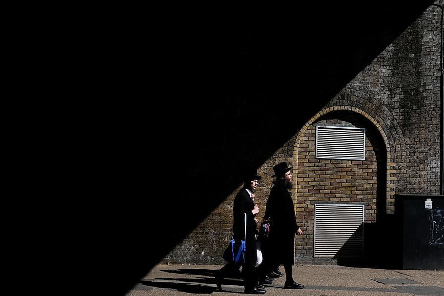 two men walking beside building, person, human, triangle, pedestrian HD wallpaper
