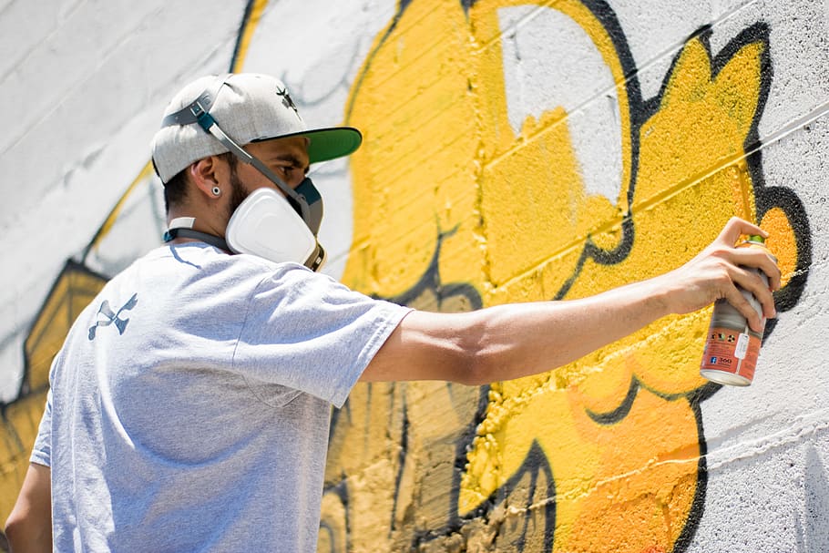 man spraying on wall, paint, graffiti, yellow, sunlight, shadow HD wallpaper