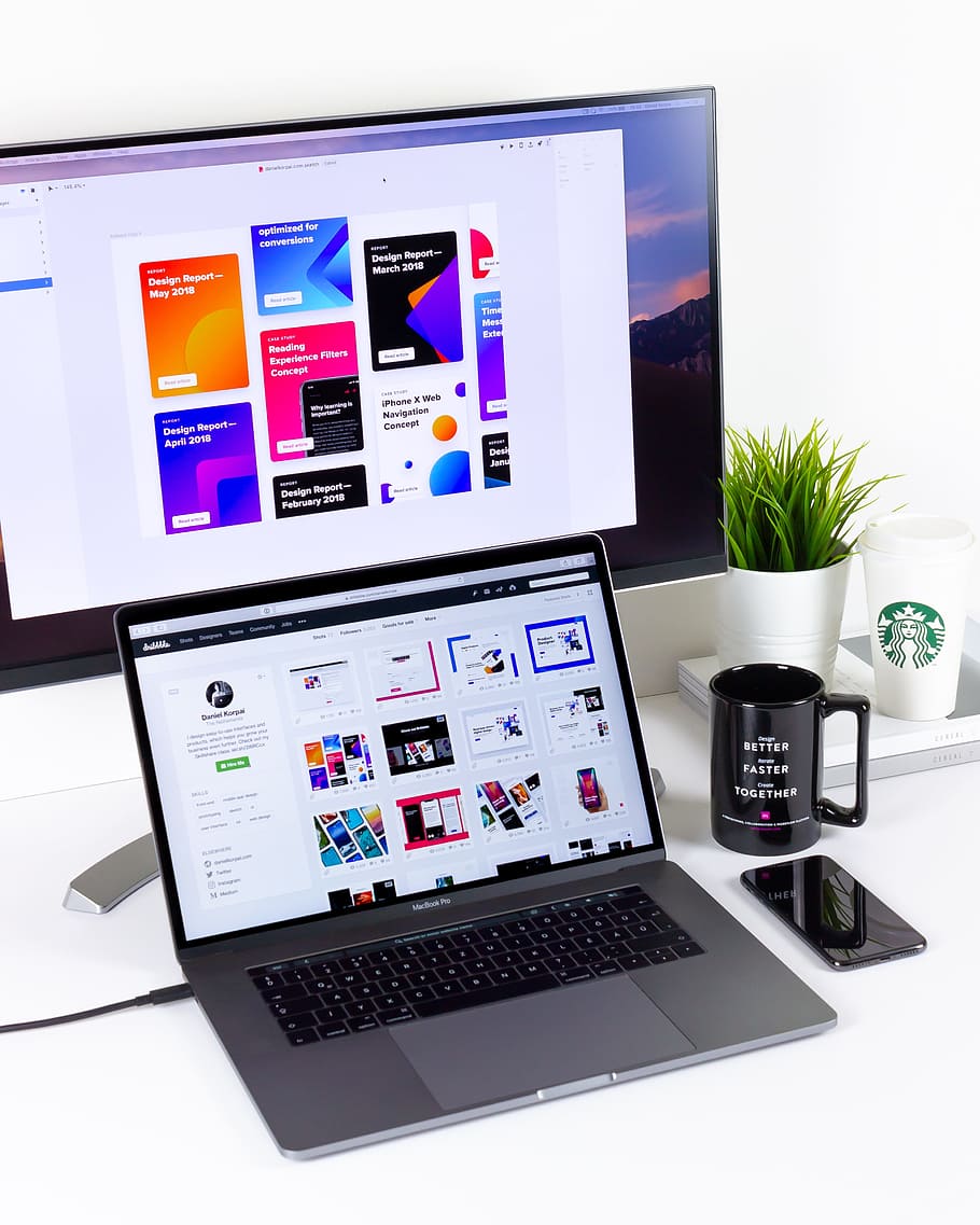 black and gray laptop computer beside black mug, iphonex, work environment