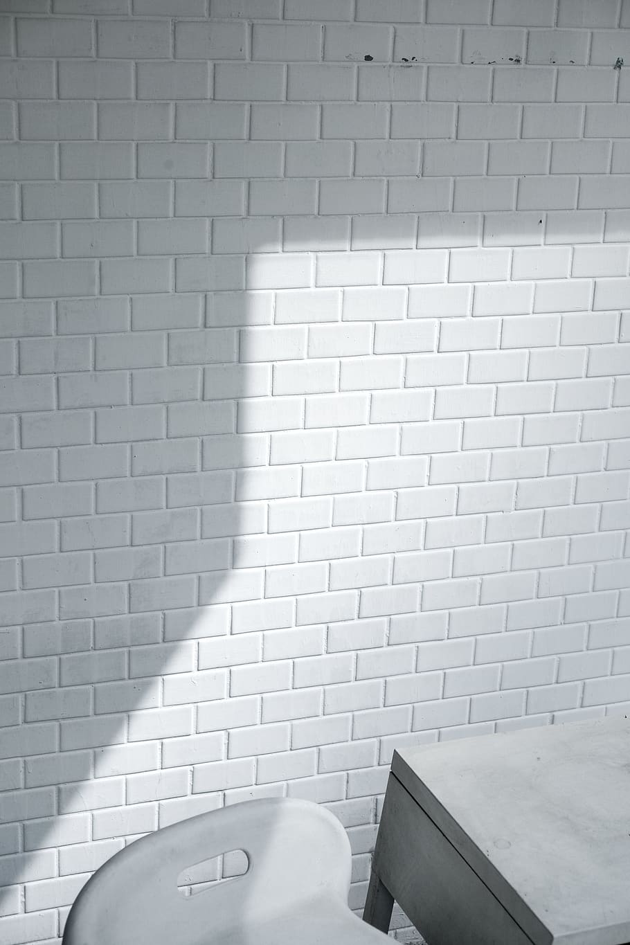 White Brick Wall Near White Chair, architecture, background, black-and-white