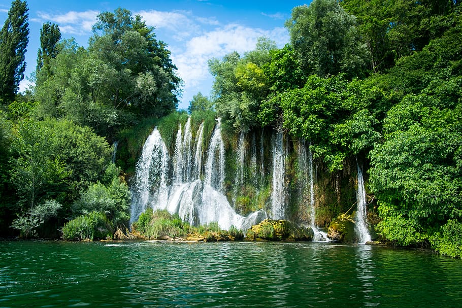 waterfalls surrounded by trees, plant, beauty in nature, scenics - nature HD wallpaper