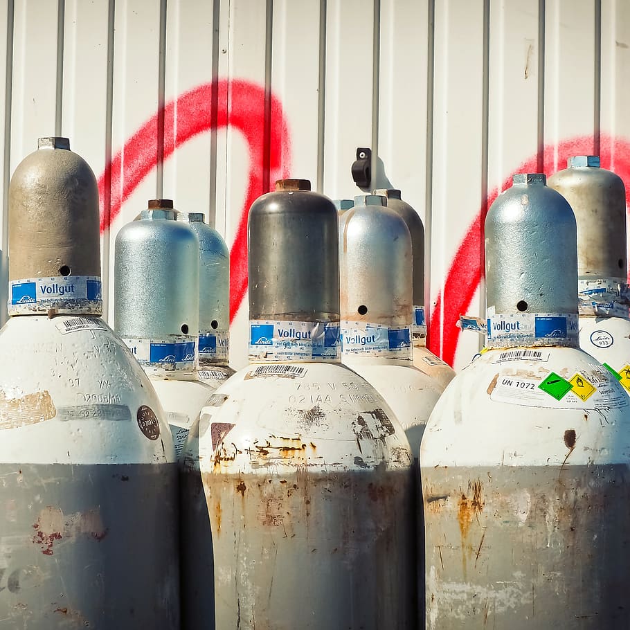 Gray Steel Gas Tanks Near White Steel Wall during Daytime, container HD wallpaper