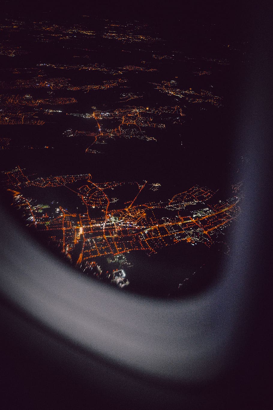 aerial view from airplane's window during night time, outdoors