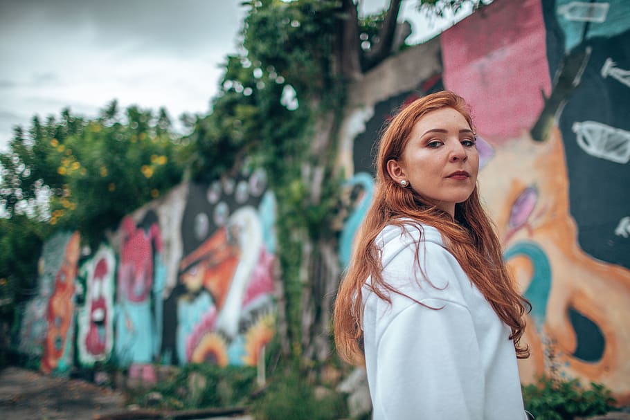 woman wearing white jacket standing near graffiti wall, grace HD wallpaper