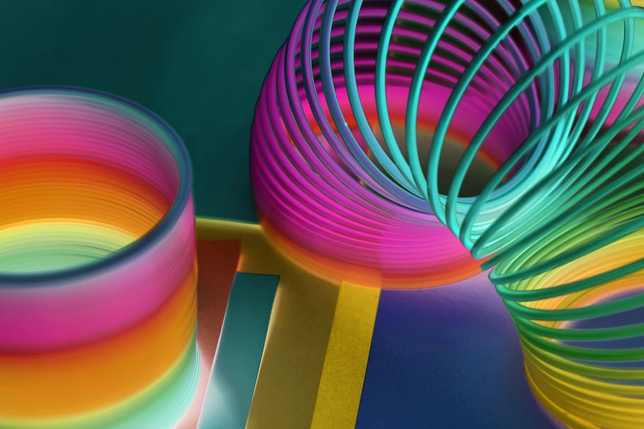 Multicolored Plastic Slinky Toy in Close-up Photography, art