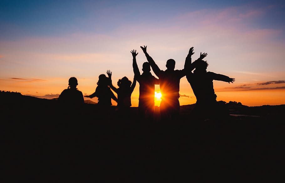 Silhouette Of People Raising Hands During Golden Hour, backlit HD wallpaper