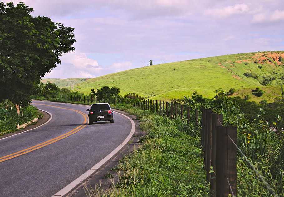 Black Vehicle on Road Near Green Leaf Plants, car, clouds, country HD wallpaper