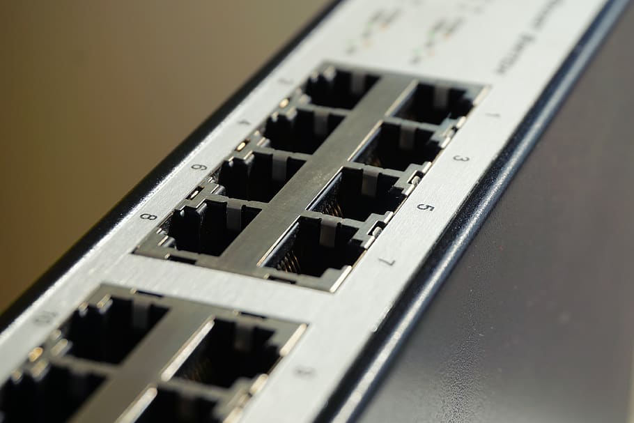 Black and White Lan Port Router in Shallow Focus Photography HD wallpaper