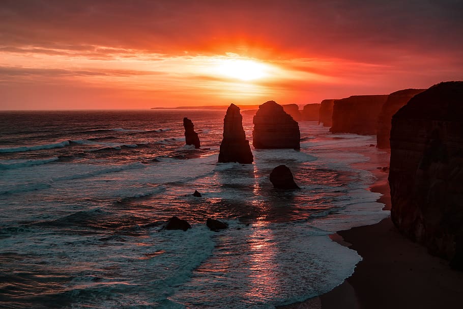 sea, ocean, water, waves, nature, sunset, sunlight, rocks, hill HD wallpaper