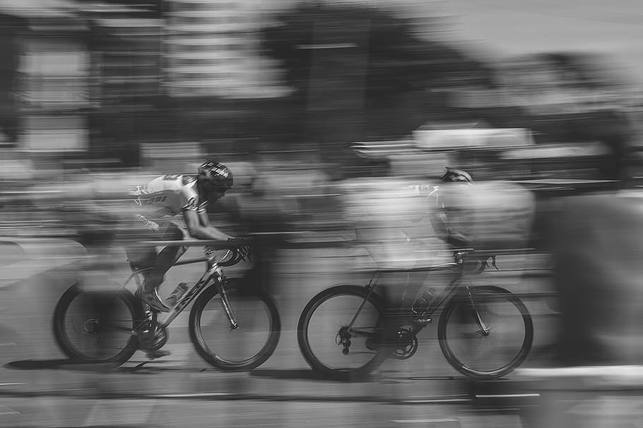 two persons riding on bicycles, blurred motion, transportation HD wallpaper