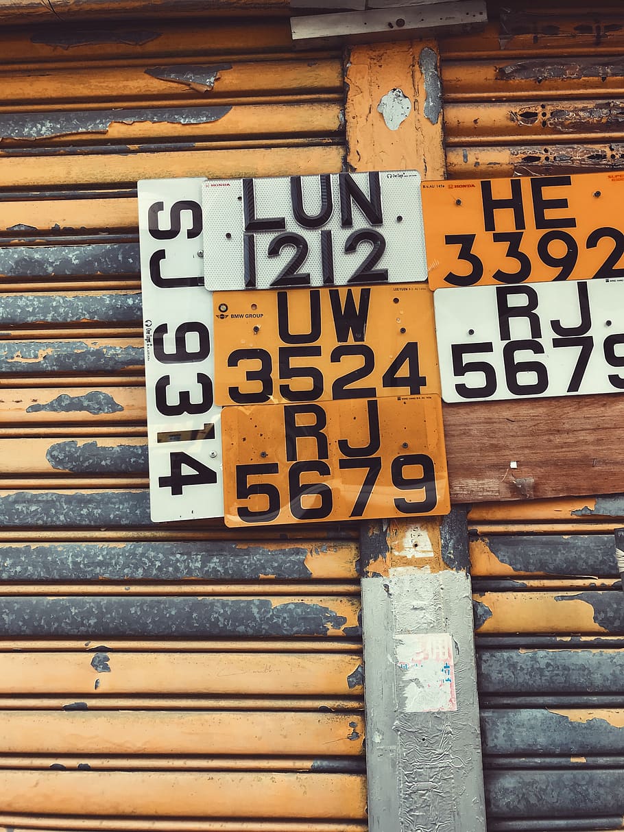 assorted license plates hanging on roller shutter, 151 ki lung st HD wallpaper