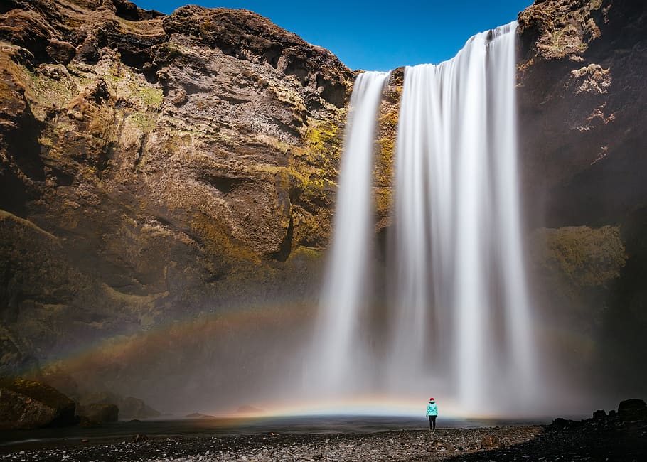 waterfall, hill, rocks, blue, sky, nature, rainbow, people HD wallpaper