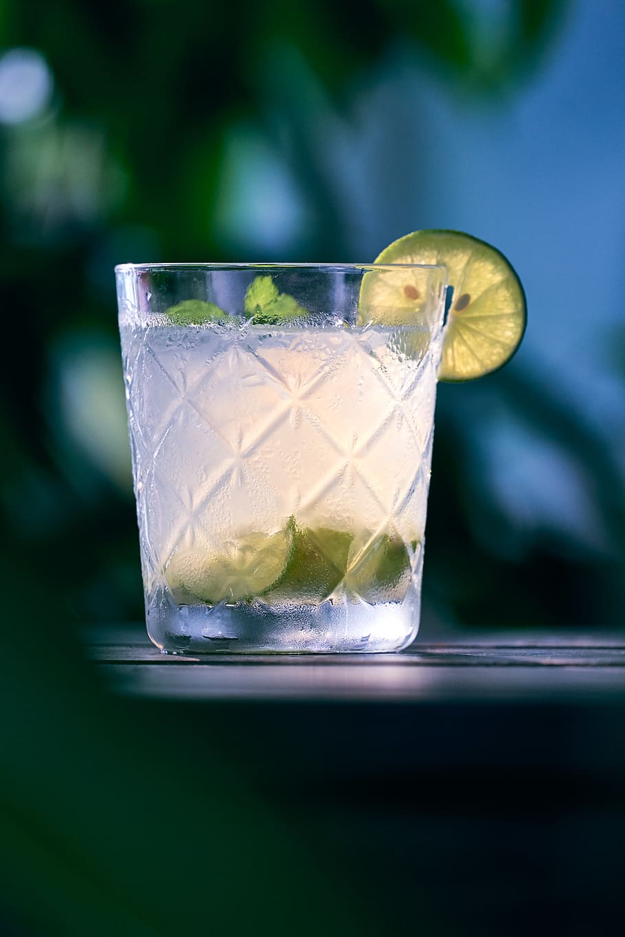 clear liquid inside clear drinking glass, lemonade, beverage