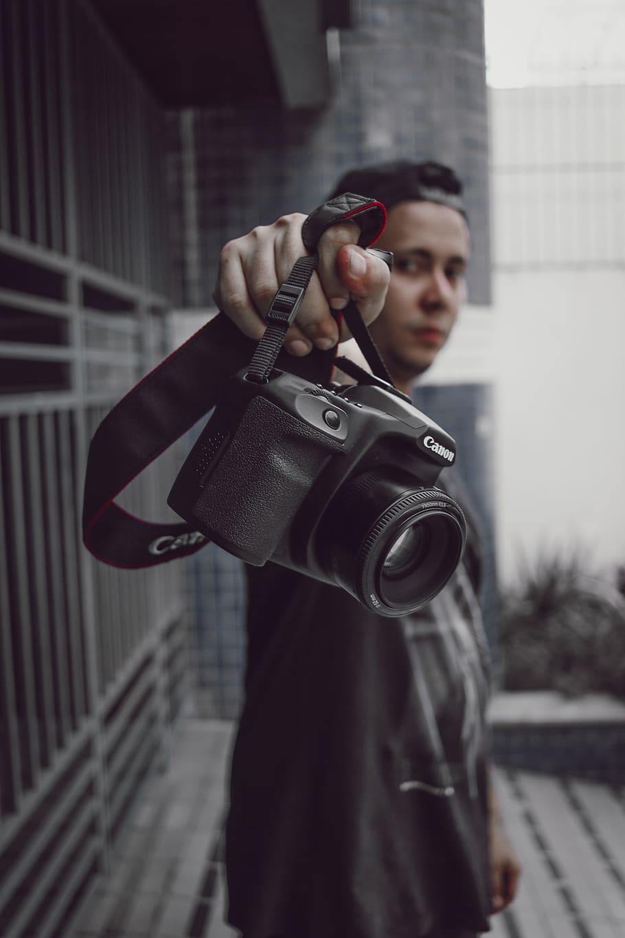 Person Holding Black Canon Camera, close-up, equipment, gadget HD wallpaper