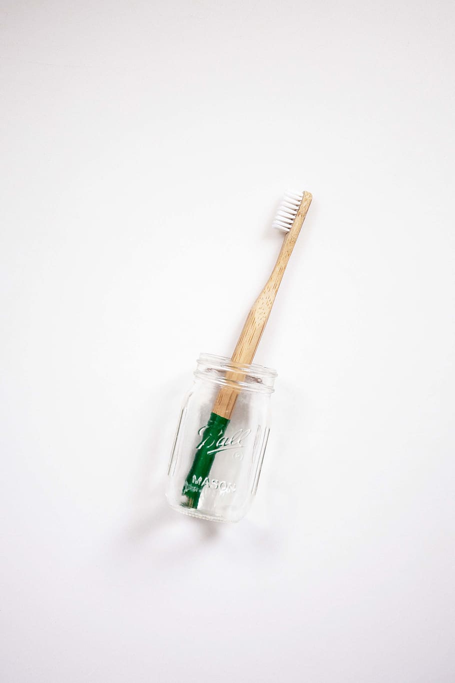 brown toothbrush in jar, studio shot, white background, indoors HD wallpaper