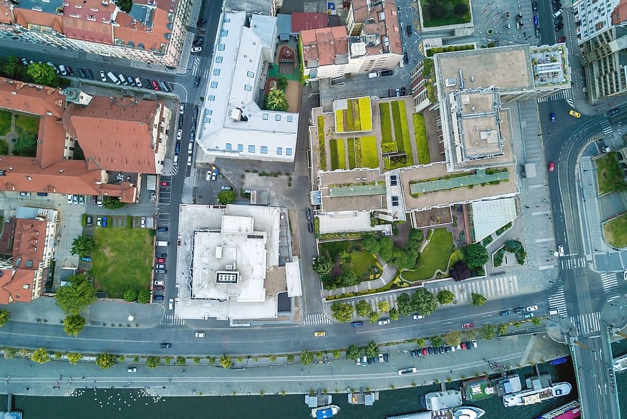 Aerial city view with crossroads and roads, houses, buildings HD wallpaper