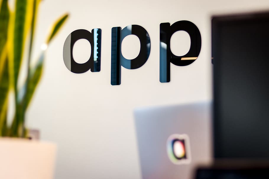 black app sign on white wall, communication, text, no people HD wallpaper