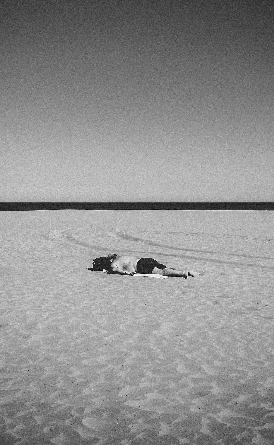 person lying on sand, sky, copy space, clear sky, sea, water HD wallpaper