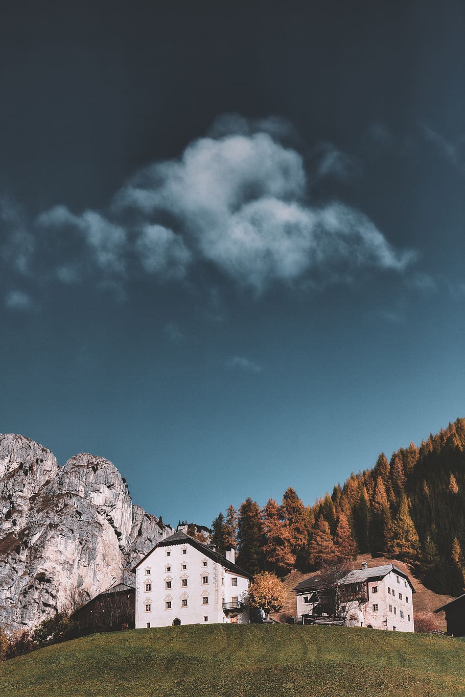 Buildings Beside Mountain Under Cloudy Sky, architecture, clouds HD wallpaper