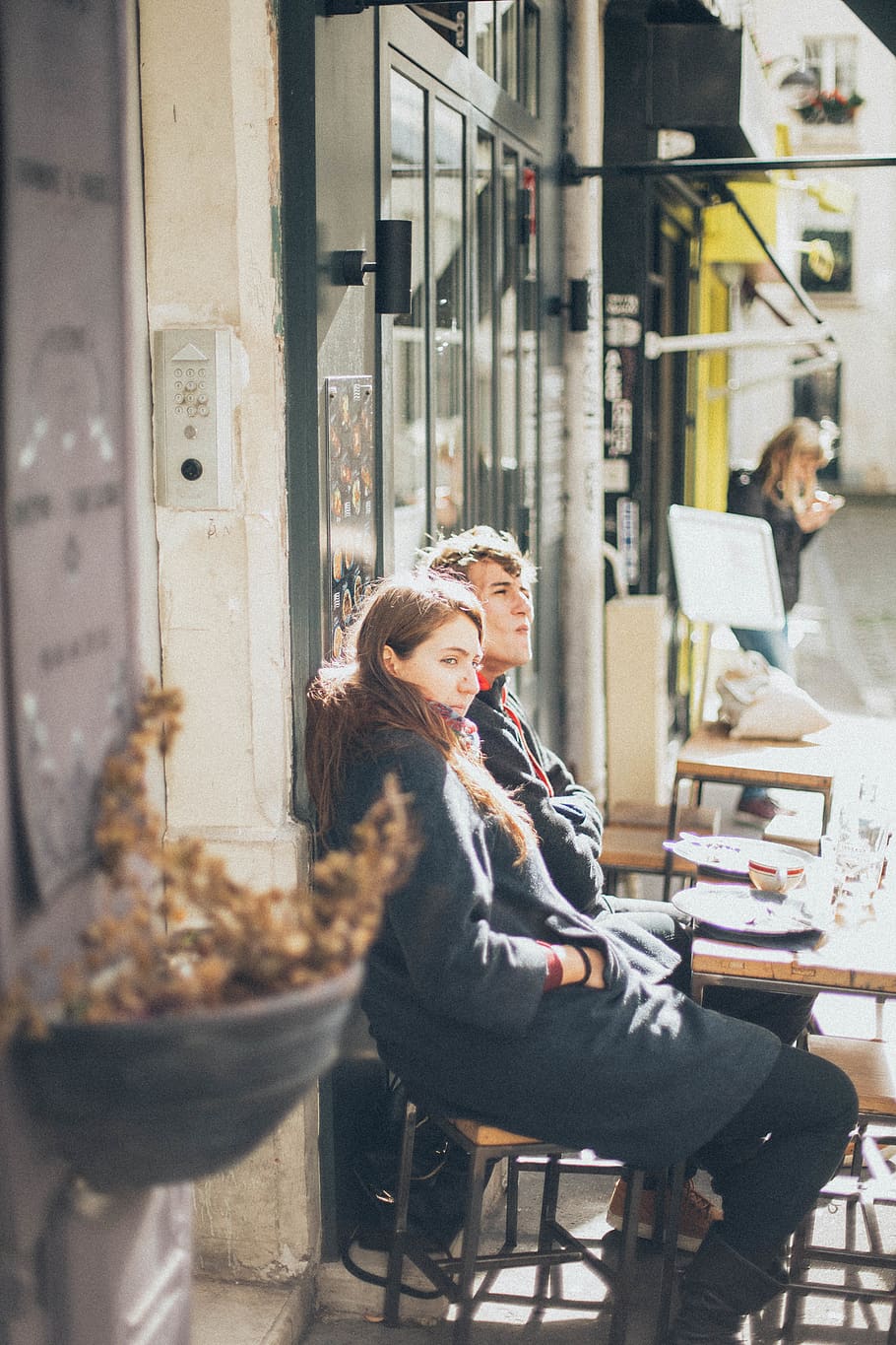 Selective Focus Photography of Woman and Man Sitting on Dining Set HD wallpaper