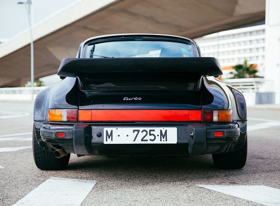 Rear view of a black sports car with low ground clearance, Motor HD wallpaper