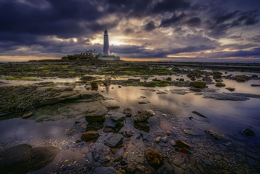 Landscape Photography of White Lighthouse during Cloudy Daytime