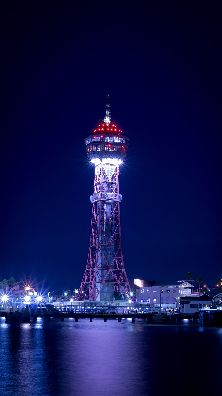 Lighted Concrete Tower Surrounded by Body of Water, architecture HD wallpaper