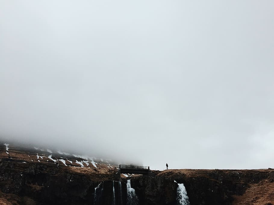 bridge, mountain, rock, formation, man, guy, snow, falls, water HD wallpaper