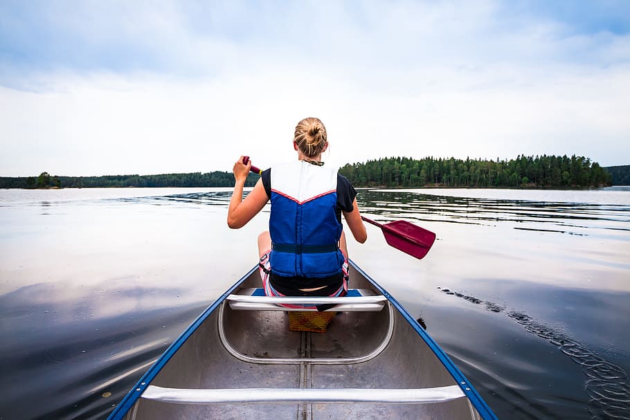 woman holding paddle riding boat on body of water, female, oar, HD wallpaper