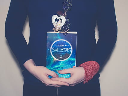solaris, blue, book, human body part, human hand, one person HD wallpaper