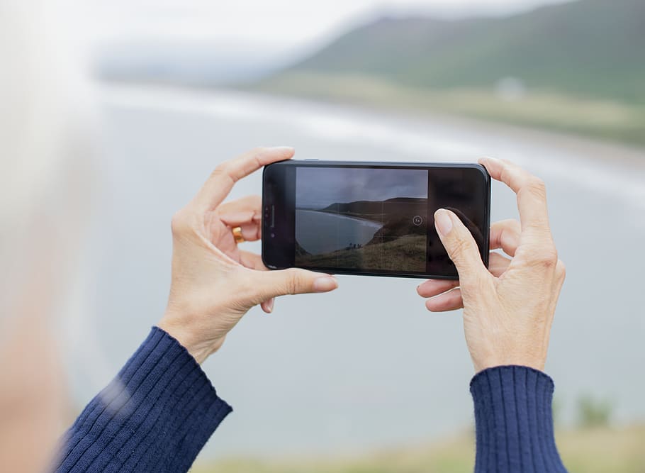 Person Holding Smartphone Taking Photo, capturing, hands, macro HD wallpaper