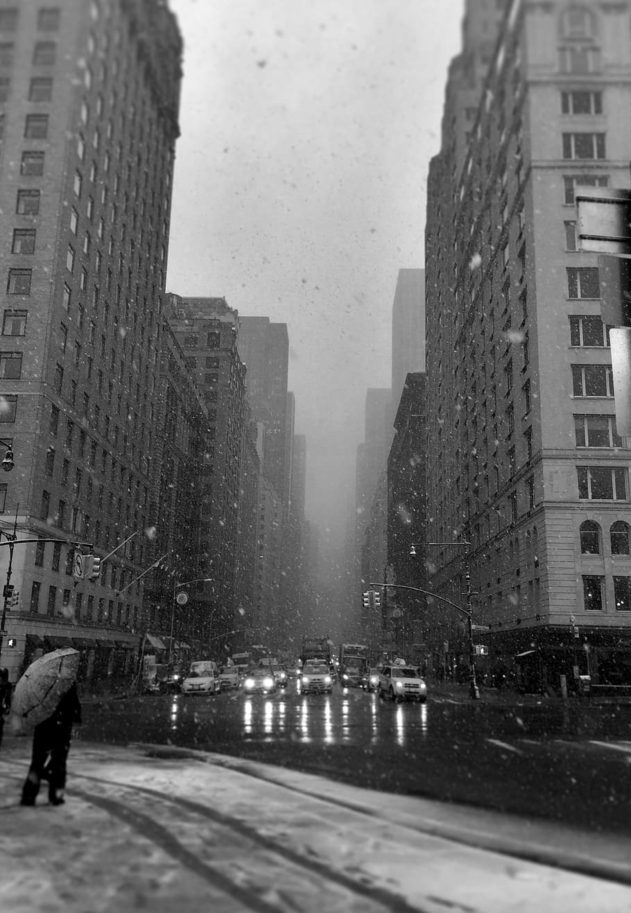 grayscale photo of high-rise buildings, street, snow, storm, outdoors