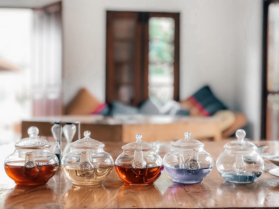 five clear glass teapots, food and drink, focus on foreground HD wallpaper