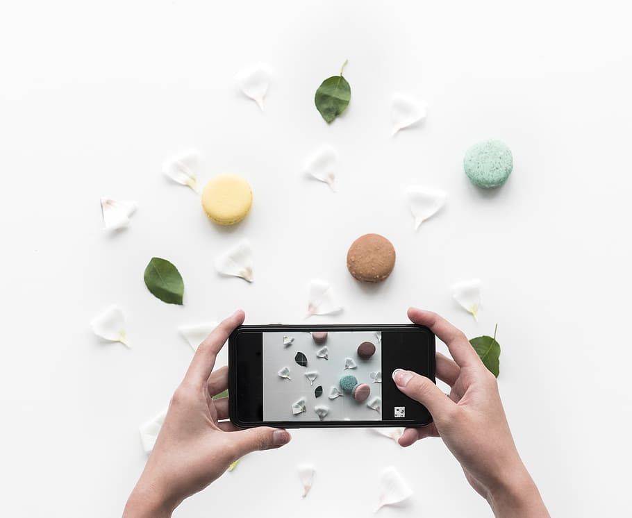 Person Taking Photo of Food and Petals Through Smartphone, background HD wallpaper