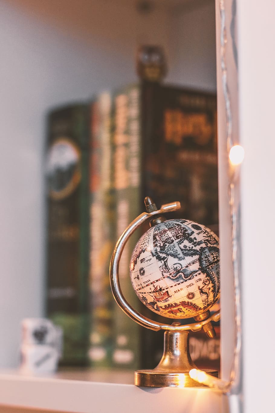 Globe, books, lights, macro, miniature, shelf, string lights HD wallpaper