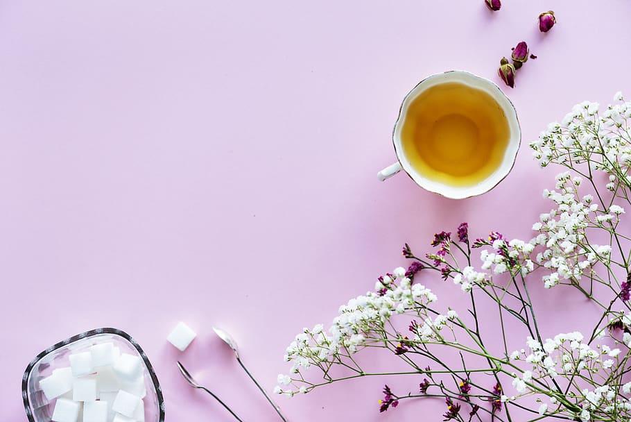 White and Purple Flowers With White Tea Cup Containing Yellow Liquid HD wallpaper